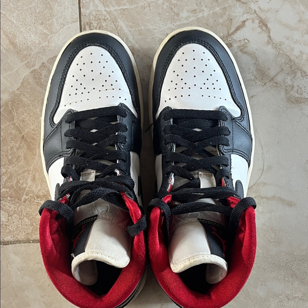 Black and White High-Top Jordans with Red Accents